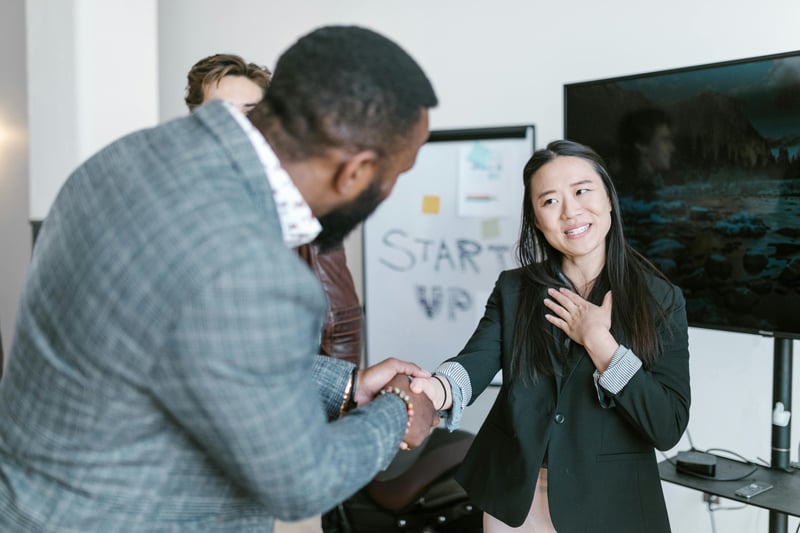 Photo by RDNE Stock project: https://www.pexels.com/photo/a-man-shaking-a-woman-s-hand-7413983/