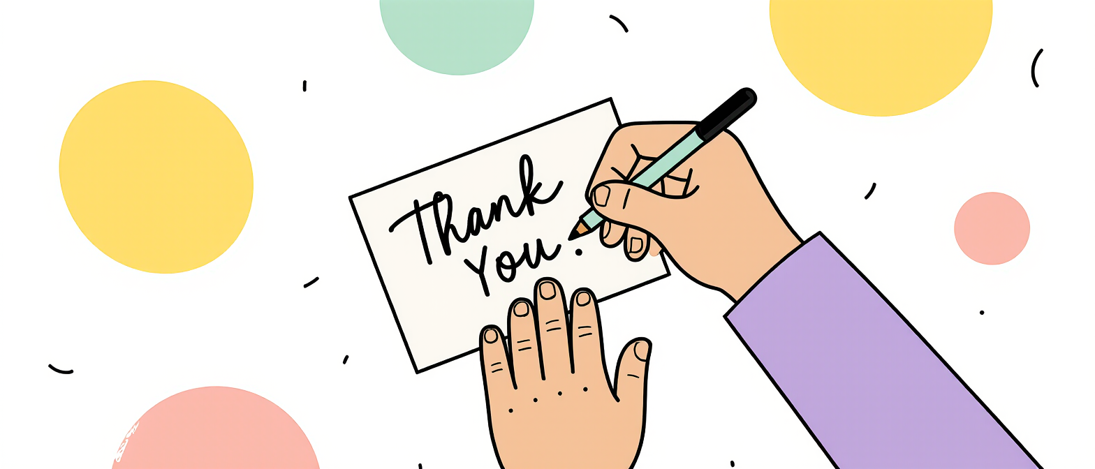 a person writing a thank you card 