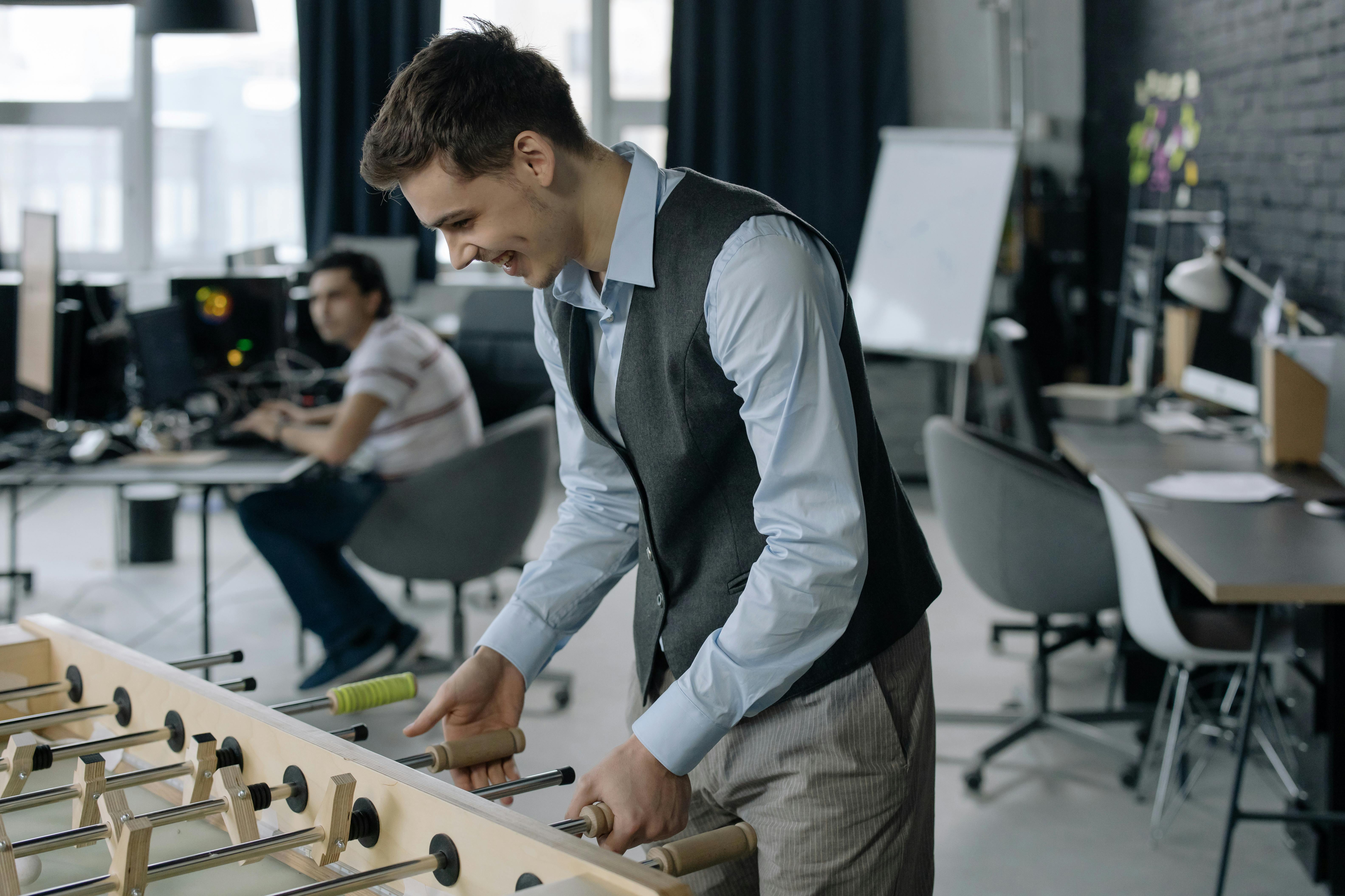 person playing foosbal at work